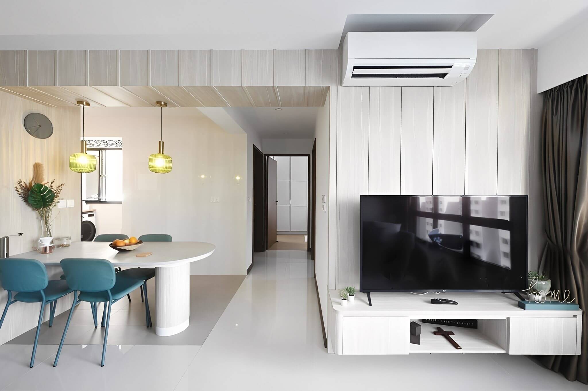 Modern minimalist living room with white walls and sleek furniture.
