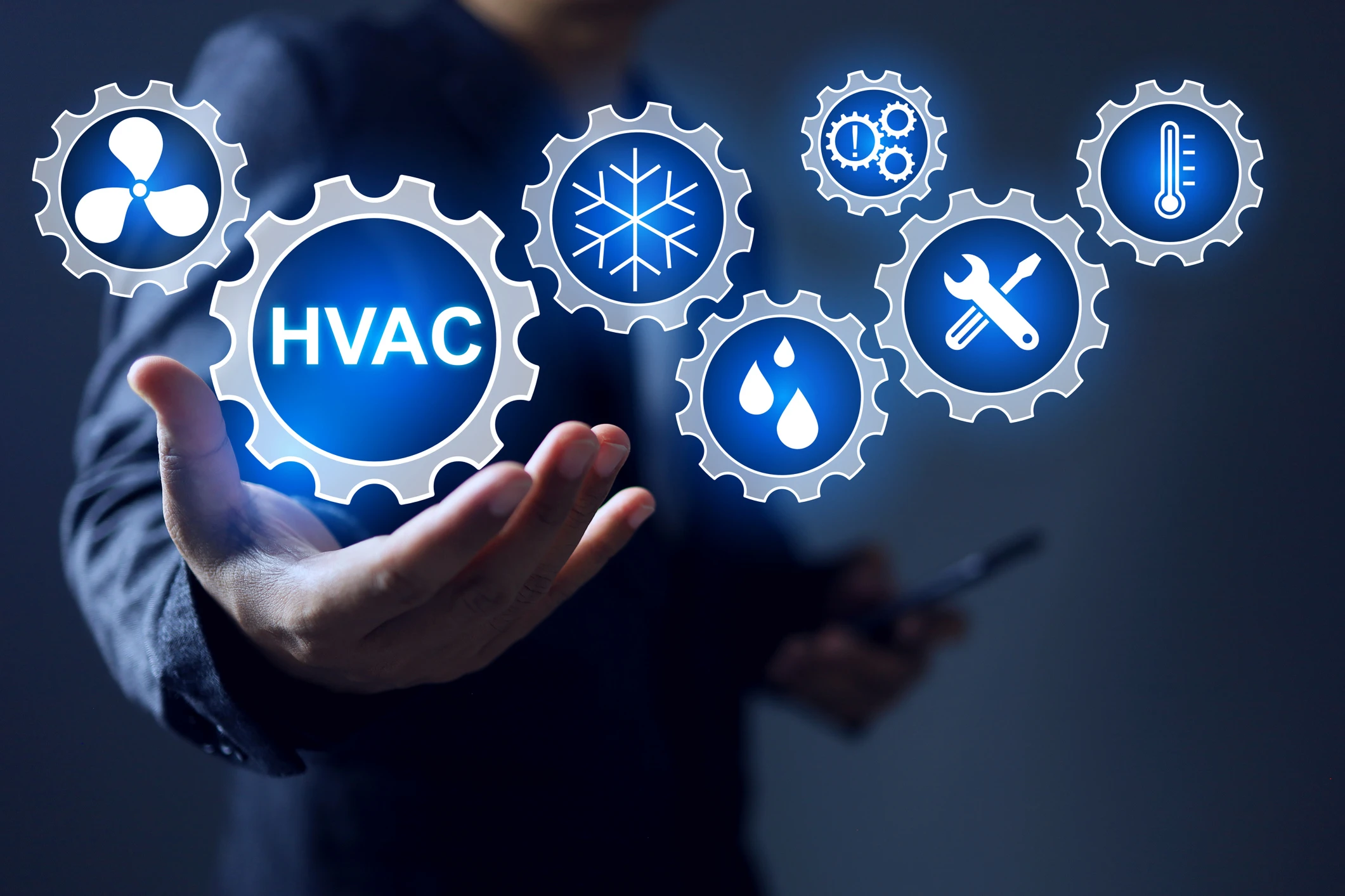 HVAC technology icons floating above hand.