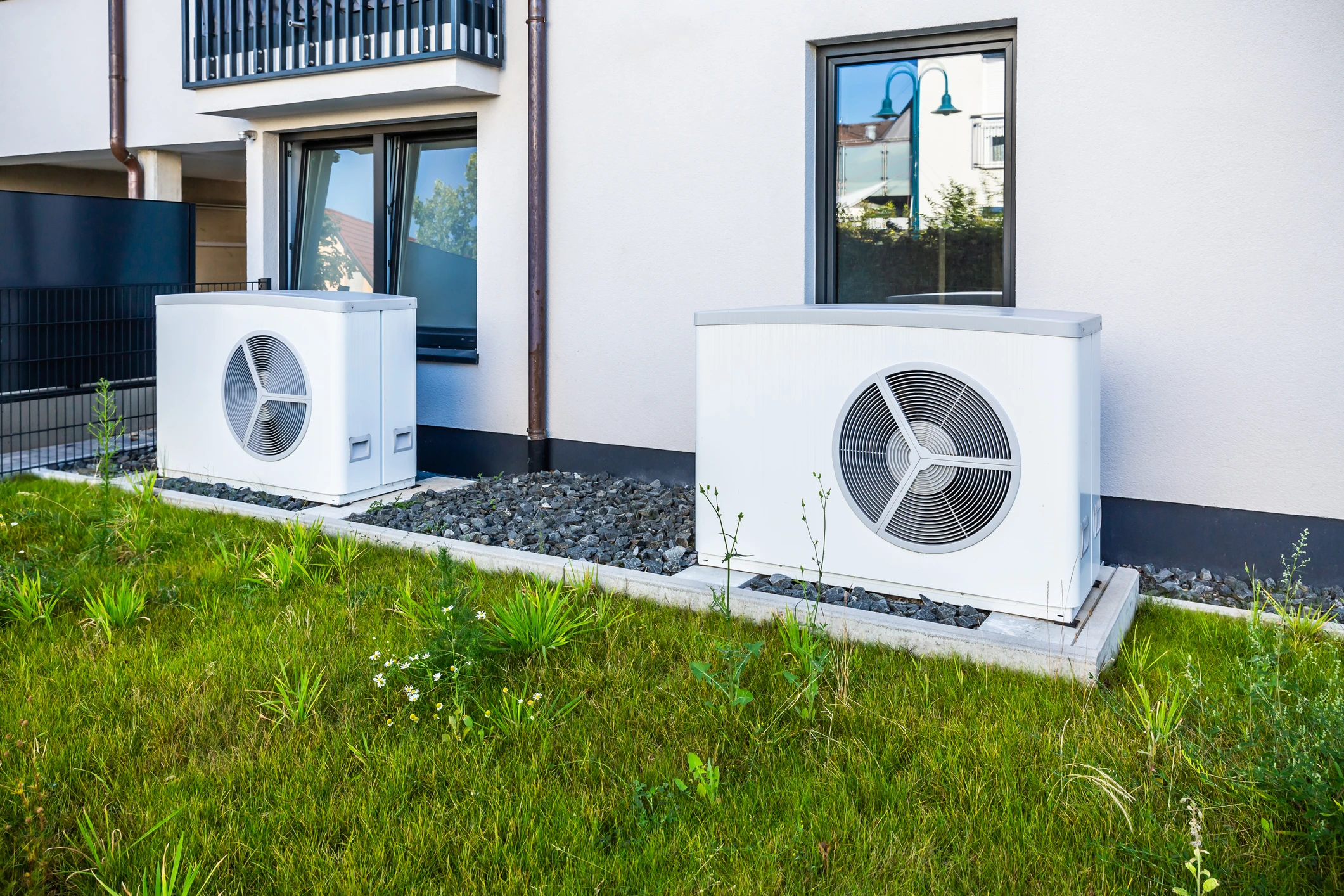 Outdoor air conditioning units beside a building.